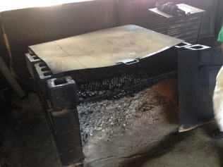 Pit for smoking meat